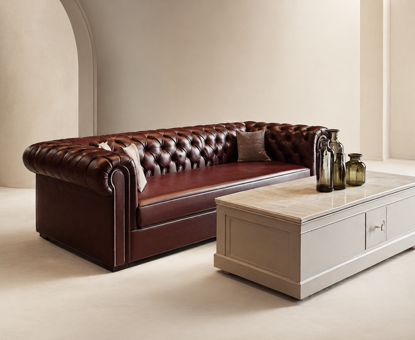 Tufted oxblood chesterfield with marble coffee table