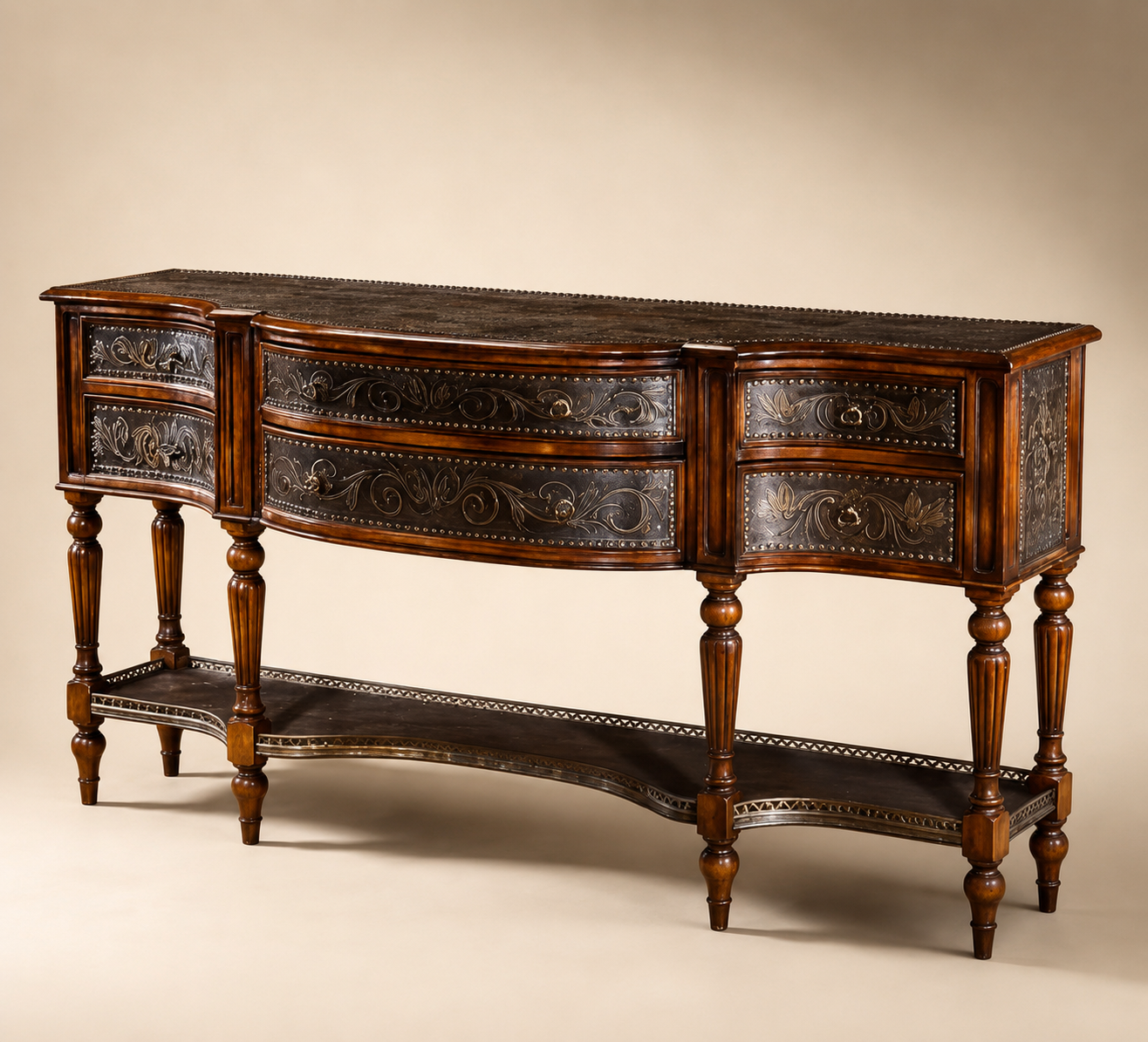 Curved carved console with leather drawer fronts